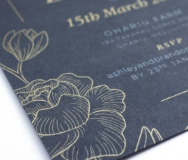 Metallic gold and opaque white on black card